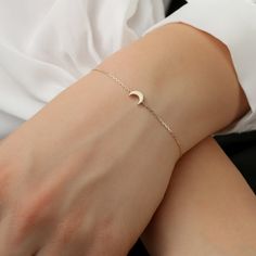 14K Gold Mini Moon Bracelet / Crescent Gold Necklace / Minimal Plain Gol Moon / Daint Moon Bracelet / Valentines Gift / From Sarah Elise ✔ Handmade ✔ Solid Gold ✔ Size of Moon: 7 x 5 mm ✔ The thickness of the Moon: 2 mm Small and sweet, this mini-moon Bracelet can be worn alone for a minimalist look. The moon is not flat but has a thickness to it for a more solid look. Put it on, make a wish, and remember to always shoot for the stars. Available 14K Solid White, Solid Yellow, Solid Rose Gold Wor Elegant Moon Charm Bracelet, Elegant Sterling Silver Bracelets With Moon Charm, Elegant Moon Phase Bracelets, Elegant Moon Phase Bracelet, Elegant Gold Moon Phase Bracelets, Elegant Gold Bracelets With Moon Phase, Elegant Silver Bracelets With Moon Phase, Elegant Moon Phase Bracelet As Gift, Dainty Moon Shaped Bracelets As Gift