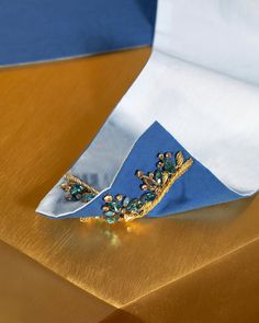 Inspired by the opulent belt sashes worn by Mughal royalty in India our wide reversible sash belt will accent your waist or hips. Hand embroidered with exquisite crystals and centuries' old Indian gold embroidery known as zardozi, this belt will elevate any look. The reversible Robin Egg Blue and Azul Blue is designed to coordinate beautifully with any of our blue and white tunics.Featured with our matching Circe Tunic in Pure White with Crystals and Gold Embellishment (available separately). • Blue Sash, Gold Embellishment, White Tunic, Sash Belts, Sash Belt, Gold Embroidery, Robins Egg Blue, Pure White, Jaipur