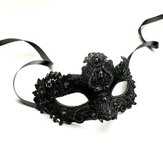 Simplistic for the man in the black mask and chic for the woman in the black mask. The woman's fabricated texture and lacing are destined to pop out at any event. Masquerade Ball Gowns Elegant With Mask Black, Black Maskerade Mask, Goth Mask Masquerade Ball, Goth Masquerade Mask, Black Mascarade Mask, Black Masks Masquerade, Gothic Masquerade Mask, Black Masquerade Mask Aesthetic, Fitted Black Masquerade Mask For Mardi Gras