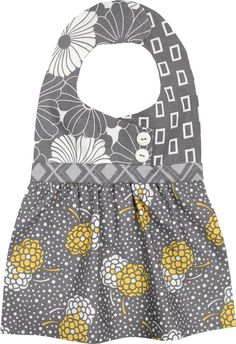 a gray and yellow bib with flowers on it