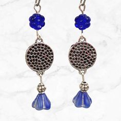 Cobalt blue earrings with silver accents. Deep blue beads contrast beautifully against silver. These long beaded earrings are lightweight and comfortable for daily wear.  Hypoallergenic ear wires (nickel and lead free). Select ear wire style at checkout. Artisan glass beads produced in small quantities in the Czech Republic. A gift for you or someone special, earrings are carded and in an organza bag. More of my silver earrings: https://www.etsy.com/shop/JezaJewelry?ref=simple-shop-header-name&l Nickel-free Czech Glass Flower Dangle Earrings, Nickel-free Czech Glass Dangle Earrings, Blue Teardrop Bohemian Flower Earrings, Blue Bohemian Teardrop Flower Earrings, Bohemian Blue Teardrop Flower Earrings, Blue Metal Beaded Drop Earrings, Silver Flower Dangle Earrings With Beads, Blue Metal Beaded Dangle Earrings, Blue Beaded Dangle Flower Earrings