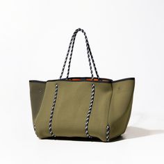 The cool, everyday bag that’s perfect for work, gym, beach, traveling, and everything in between. Khaki Rectangular Beach Bag For Daily Use, Khaki Shoulder Beach Bag For Everyday Use, Sporty Green Bag For On-the-go, Khaki Everyday Shoulder Beach Bag, Khaki Shoulder Beach Bag, Green Bags With Luggage Sleeve For Everyday Use, Everyday Green Bag With Luggage Sleeve, Everyday Green Bags With Luggage Sleeve, Khaki Tote Beach Bag For Everyday