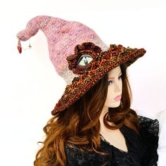 A renfair costume, witch festival, dragon cosplay, dragon event, gaming, or you're just a dragon lover - This beaded dragon eye witch hat is soft, comfortable, and unique. I've made this hat to be soft to wear and firm enough to stand on its own. The body is a blend of mohair and wool, in felted crochet. Ive added a wire high inside towards the tip and a touch of stuffing for ultimate shaping and adjusting ability. I've crocheted the brim in colorful dragon scales, all the way to the wired edge. Each scale is hand beaded with a gold bead at the tip of the scale. The large eye is 3 dimensional, with faux leather lids and a crocheted frill. A golden trim enameled seashell and charm dangle from the tip for the unusual treasures being collected. The felted crochet body allows for a soft stretc High Crown Hats For Halloween Cosplay, Halloween Fantasy Costume Hat With High Crown, One Size Fits Most Costume Accessories For Halloween Cosplay, One Size Fits Most Costume Accessories For Cosplay Halloween, One Size Fits Most Halloween Cosplay Accessories, Handmade Costume Hats And Headpieces For Halloween Cosplay, Handmade Halloween Costume Hats And Headpieces For Cosplay, Fantasy Costume Hats And Headpieces For Halloween Carnival, High Crown Costume Hat For Halloween