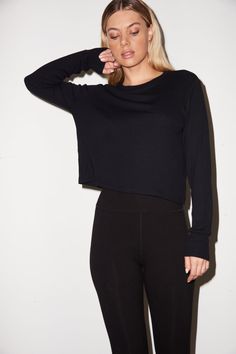 Classic fitting long sleeve top Model is 5'8" and wearing a size small Material: 95% Rayon, 5% Spandex Recommended Care: Machine wash on gentle cycle and tumble dry low Zipper Leggings, High Rise Style, Bathing Suit Bottoms, Sweaters Hoodies, High Rise Leggings, Black Rib, Zipper Detail, Get It Now, Bike Shorts