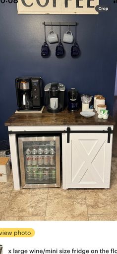 a coffee bar with two mini fridges on the counter and a sign above it