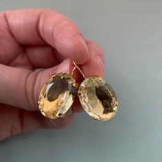 "Light YELLOW Large OVAL Paste Earrings, Gold Fixed Lever backs, Oval glass stones, lovely Georgian PASTE earrings, stunning vintage glass LIMITED EDITION: these will not be regular shop stock, so grab these while you can! This listing is for simply lovely vintage glass stones in a SOFT Light YELLOW (these are Czech glass most likely), mounted on fixed 16k gold plated lever backs - HANDMADE pair of earrings. As you can see, these lovely OVAL shaped glass stones subtly catch the light and reflect Vintage Gold Gemstone Earrings, Vintage Crystal Earrings For Formal Occasions, Vintage Oval Earrings As Gift, Gold Oval Crystal Earrings For Wedding, Vintage Oval Earrings For Gift, Vintage Gold Crystal Earrings For Anniversary, Formal Oval Gold Crystal Earrings, Vintage Gold Oval Earrings, Vintage Oval Earrings With Lever Back Ear Wires