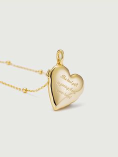 A cherished keepsake that allows you to carry your most precious memories close to your heart. This exquisite pendant features a heart-shaped locket, meticulously crafted with the finest attention to detail and designed to hold a special photo of your choosing. This versatile pendant is suitable for everyday wear or as a special piece for significant occasions. Whether it's a cherished family photo, a picture of a loved one, or a memento of a memorable event, this locket serves as a tangible rem Elegant Heart Pendant Locket Necklace With Charms, Double Heart Locket Necklace Keepsake, Double Heart Locket Necklace For Keepsake, Personalized Locket Heart Necklace For Mother's Day, Personalized Heart Locket Necklace For Mother's Day, Keepsake Birthstone Locket Pendant Necklace, Keepsake Birthstone Pendant Locket Necklace, Engraved Locket Necklace For Valentine's Day Keepsake, Heart Locket Necklace For Valentine's Day Keepsake