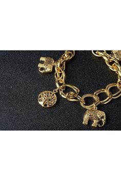 Description: Elevate your style with our Women's Gold Charm Bracelet, a perfect addition to your jewelry collection. This fashionable charm bracelet is designed for adult women and is suitable for various occasions, including cocktail parties, holiday events, and vacations. The gold color adds a touch of elegance to any outfit. It features a charming elephant and Tree of Life charms, making it a meaningful accessory. The bracelet is sizeable, with an adjustable fit ranging from approximately 6 ½ Chunky Charm Bracelet, Gold Charm Bracelet, Gold Fashion, Copper Color, Gold Jewelry Fashion, Gold Charm, Tree Of Life, Holidays And Events, Gold Color