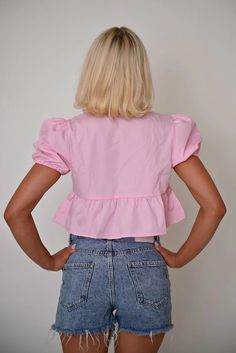 This vibrant pink cropped top combines playful elements with functional design, offering a fresh take on casual wear. Featuring a unique tie-front closure and ruffled details, this piece is perfect for those looking to add a splash of color and whimsy to their wardrobe. Features: Material: Made from a lightweight cotton blend, ensuring comfort and ease of wear. Special Features: This top includes a tie-front design that allows for adjustable fitting and adds a decorative touch. Technical Specifi Pink Cropped Top, Solid Color Sweater, Unique Ties, Sleeveless Short Dress, Graduation Outfit, Cropped Style, Puffed Sleeves, Cropped Top, Front Design