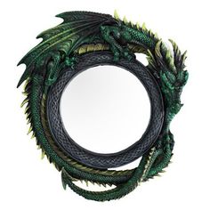 a green and black dragon wreath with mirror in the middle on a white background photo