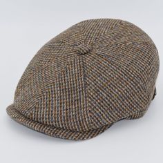 a brown and blue plaid hat on a white background