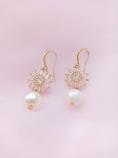 An elegant pair of cubic zirconia and pearl wedding earrings , adorned with freshwater pearls. Perfect jewelry to complete your wedding day look or to gift to bridesmaids Elegant Dangle Bridal Earrings With Pearl Pendant, Elegant Pearl Pendant Dangle Bridal Earrings, Dangle Pearl Earrings Fine Jewelry, Elegant Pearl Dangle Earrings, Elegant Pearl Bridal Earrings With Pearl Chain, Elegant Pearl Chain Bridal Earrings, Exquisite Pearl Drop Jewelry With Cubic Zirconia, Elegant Cubic Zirconia Bridal Earrings With Pearl Drop, Elegant Rose Gold Plated Pearl Earrings