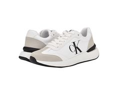 Calvin Klein Dilbur - Men's Shoes : Light Grey : Style your look in the chic and classy design of the Calvin Klein Dilbur sneakers. Faux suede upper. Cotton lining and cushioned insole. Lace-up closure. Almond toe construction. Calvin Klein monogram logo on the sides. Synthetic rubber outsole. Imported. Jogging Sneakers With Logo And Round Toe, Logo Sneakers For Jogging With Round Toe, Logo Sneakers With Round Toe For Jogging, Modern Low-top Sneakers With Logo Print, Leather Sneakers With Logo Print For Jogging, Modern Low-top Logo Sneakers, Modern Low-top Sneakers With Logo, Modern Sneakers With Embossed Logo And Round Toe, Suede Sneakers With Embossed Logo