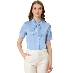 This shirt looks applicable to everyday work clothes in addition to dress-up. The silky fabric shapes this shirt with a tie-neck collared neckline and short sleeves. The curved hem gives it a neat finish over pants. The tie-neck adds casual-inspired sophistication, while soft fabric gives it an elegant, feminine shape. This elegant satin shirt features a tie-bow neck and short sleeves, making it a versatile addition to your wardrobe. Suitable for various occasions including work, office, formal Solid Color Semi-formal Office Shirt, Blue Collared Blouse For Work, Office Lady Formal Collared Shirt, Formal Collared Shirt For Office, Formal Collared Shirt, Semi-formal Office Lady Shirt, Blue Office Lady Blouse For Workwear, Blue Professional Blouse For Work, Collared Short Sleeve Shirt For Work