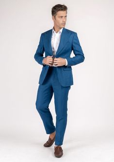 The Hudson Marine Blue Linen Suit is the perfect expression of summer luxury. Crafted from 100% linen in a vibrant marine blue hue, this custom suit will make an elegant statement wherever you wear it. Perfect for hot summer days, its lightweight fabric will keep you looking sharp while feeling cool and comfortable. Summer Blue Blazer With Suit Collar, Blue Summer Blazer With Suit Collar, Blue Linen Blazer For Workwear, Fitted Linen Summer Suits, Summer Fitted Linen Suit, Elegant Blue Summer Suits, Luxury Tailored Suits For Summer, Blue Notch Lapel Blazer For Summer, Summer Linen Suit With Suit Collar