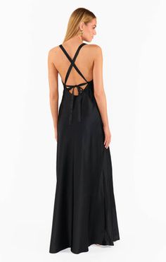 Raise a glass in the Anderson Maxi Dress! Sleek, black satin shapes this chic dress with an open back and criss cross ties. This flattering, floor length dress exudes glamour. Style with strappy heels and dainty gold jewelry for your next event. Chic Satin Finish Maxi Dress For Night Out, Elegant Maxi Dress With Corset Back For Date Night, Chic Corset Back Maxi Dress For Night Out, Chic Maxi Dress With Corset Back For Night Out, Silk Maxi Dress With Tie Back For Night Out, Elegant Slip Dress With Strappy Back And Bias Cut, Evening Dress With Crisscross Straps And Strappy Back, Chic Evening Dress With Strappy Back, Evening Dresses With Crisscross Straps