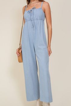 THE PERFECT MIX OF FLIRTY AND FUN, THIS JUMPSUIT IS READY FOR ANY SUMMER OCCASIONS. THE FLOWY SILHOUETTE IS COMPLEMENTED BY A SQUARE NECK LINE, RUCHED BUST, AND FRONT KEYHOLE DETAILS. WHETHER YOU ARE SIPPING COCKTAILS OR DANCING THE NIGHT AWAY, THIS DENIM BLUE JUMPSUIT WILL HAVE YOU FEELING THE BEST.* SLEEVELESS DESIGN* SPAGHETTI STRAP* SELF FRONT TIE* FRONT KEY HOLE* LIGHTWEIGHT MATERIAL* THE MODEL IS 5'9" AND WEARING SIZE SMALLMade In: ChinaFabric Contents: 90% cotton 10% viscoseSize Measureme Chic Medium Wash Cotton Denim Jumpsuit, Denim Blue Cotton Jumpsuit For Day Out, Medium Wash Cotton Denim Jumpsuit For Day Out, Denim Blue Relaxed Fit Jumpsuit For A Day Out, Chic Light Wash Cotton Jumpsuits And Rompers, Light Wash Relaxed Denim Jumpsuit For Day Out, Casual Denim Jumpsuit For Spring, Casual Denim Blue Jumpsuit For Day Out, Chic Light Wash Denim Jumpsuit For Spring