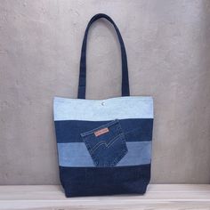 Hand made  Jeans shoulder bag. This is comfortable and capacious bag with lining. It's simple and functional.  Magnetic button closure. Two pockets, one outside the other inside SIZES: 10*28*35 cm / 3,93*11,02*13.77 inch Capacious Bag, Denim Tote, Jeans Bag, Denim Gift, Latvia, Second Life, Hand Made, Shoulder Bag, Purses And Bags