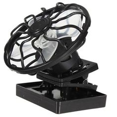 an old fashioned black fan sitting on top of a stand with it's blades still attached