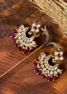 Celebrate the rich heritage of traditional jewelry with our "Heritage Echo" Traditional Earrings, meticulously crafted to echo the opulence of a bygone era. These earrings feature the timeless combination of a deep red stone and uncut Kundan, paying homage to tradition and artistry. They are a versatile and captivating accessory that adds grace and cultural significance to your attire. Materials: Deep Red Stone: The earrings feature a deep red stone, chosen for its rich and vibrant hue, symboliz Festive Heavy Temple Jewelry Earrings, Festival Kundan Temple Jewelry Earrings, Kundan Temple Jewelry Earrings For Festivals, Temple Jewelry Kundan Earrings For Festivals, Ceremonial Temple Jewelry Chandbali Earrings, Kundan Temple Jewelry Earrings, Traditional Chandbali Earrings With Intricate Design, Heavy Temple Jewelry Earrings For Diwali, Bollywood Chandbali Earrings For Ceremonies