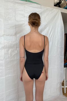 In 2015 our initial collection was based on four swim basics, the Straight One Piece is the one that started it all. Straps are wide set with our signature flattering straight neckline and finished with a mid-cut leg. The Cloud Top is the top version of the Straight One Piece and is a nice alternative for those who want this straight fit as a bikini set. The Straight One Piece is manufactured in New York City. Fit notes – The Straight One Piece fits true to size, we recommend to take your normal Sleek Swimwear With Built-in Bra For Summer, Sleek Lined Swimwear For The Beach, Sleek Lined Swimwear For Beach, Sleek Fitted Swimwear With Built-in Bra, Sleek Backless Swimwear For Summer, Sleek Low Back Swimwear For The Beach, Sleek Seamless Swimwear For Beach, Sleek Swimwear For Poolside Summer, Sleek Seamless Beach Swimwear