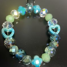 Crystal Handmade One Of A Kind Stretch Bracelet Blue Green With Ab Crystals And Heart Detail Blue Adjustable Charm Bracelet For Party, Adjustable Blue Charm Bracelet For Parties, Adjustable Blue Charm Bracelet For Party, Light Blue Faceted Beads Bracelet As A Gift, Light Blue Faceted Beads Bracelet For Gift, Light Blue Faceted Beads Bracelets As Gift, Adjustable Light Blue Bracelets With Faceted Beads, Light Blue Adjustable Bracelet With Faceted Beads, Adjustable Light Blue Bracelet With Faceted Beads