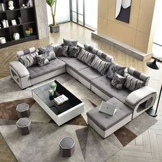 a modern living room with grey and white furniture