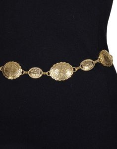 Catch the bohemian spirit and Southern California essence with our "Sunset Serenade Chain Belt." This piece is the perfect addition to take your outfit from simple to stunning with a nod to vintage charm. Fit: Adjustable chain for a customizable waist fit Style: Vintage-inspired, antique gold-tone conchos Occasion: Perfect for jazzing up a casual day look or adding flair to evening attire Styling Suggestions: Layer over a flowing maxi dress or cinch a billowy blouse for an effortlessly chic silh Gold Chain Belt For Summer Festival, Bohemian Gold Chain Belt, Bohemian Gold Chain Belt With Adjustable Chain, Gold Chain Belt For Beach, Adjustable Vintage Chain Belt, Bohemian Adjustable Chain Belt As A Gift, Bohemian Style Adjustable Metal Chain Belt, Vintage Gold Chain Belt For Festivals, Bohemian Adjustable Chain Belt For Festivals