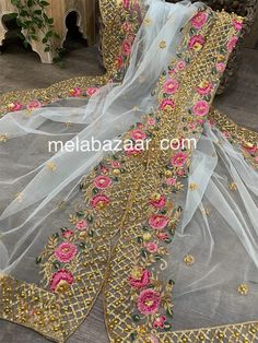 Gorgeous net dupatta with floral embroidered border and sequins work. Light Sky Blue Eid Traditional Wear With Dabka Work On Net, Festival Net Saree For Celebration, Traditional Embroidered Net Fabric For Eid, Traditional Net Embroidered Fabric For Eid, Embroidered Semi-stitched Net Salwar Kameez, Embroidered Fabric With Dabka Work For Diwali Celebration, Festive Embroidered Fabric With Dabka Work For Celebrations, Eid Embroidered Net Lehenga, Embroidered Net Sharara For Eid