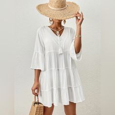 Summer Is A Time For Relaxation And Fun, And What Better Way To Enjoy It Than With Comfortable And Stylish Clothing? This Solid Color White V-Neck Dress Is Perfect For A Day At The Beach Or A Casual Outing. With 3/4-Sleeves And A Loose Fit, It Provides Both Comfort And Style. The Ruffle Hem Adds A Feminine Touch To The Dress, Making It A Must-Have For Any Summer Wardrobe. So Why Wait? Upgrade Your Summer Wardrobe With This Versatile And Trendy Dress Today! Summer Resort Wear Solid Color White V- Summer Vacation Dress With Half Sleeves, Summer Vacation Dresses With Half Sleeves, Half Sleeve Summer Vacation Dresses, Spring Beach Dress With Half Sleeves, Spring Beach Dresses With Half Sleeves, Flowy Dresses With 3/4 Sleeves For Vacation, Flowy Half Sleeve Beach Dress, White Half Sleeve Dress For Beach, White Half Sleeve Dress For The Beach