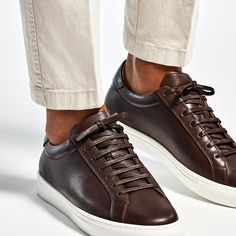 Crafted from supple calf leather, these brown sneakers feature a light brown leather lining and a white herringbone rubber sole. Brown Low-top Calf Leather Shoes, Modern Brown Leather Sneakers, Brown Calf Leather Sneakers With Stitched Sole, Brown Calf Leather Sneakers With Leather Sole, Brown Sneakers With Leather Lining And Round Toe, Brown Calf Leather Sneakers With Rubber Sole, Brown Sneakers With Leather Sole And Round Toe, Brown Leather Lined Sneakers With Round Toe, Brown Low-top Leather Shoes With Contrast Sole