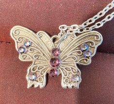 "S111  remarkable butterfly in pure silver, that is .999 silver that is purer than sterling The chain is bought - but ALSO HANDMADE BY A CRAFTSMAN, in an oval link pattern. It is 24\" long so the pendant rests low on the chest.  If you want a shorter chain, please let me know when you order, and tell me the length you want.The chain is sterling silver.  The details of the butterfly are defined with scrollwork. All handmade 3 Amethyst stones 6 Swarovski crystals   Note the reverse side, I always Silver Butterfly Metal Jewelry, Silver Metal Butterfly Jewelry, Elegant Silver Butterfly Necklace In Sterling Silver, Silver Jewelry With Butterfly Charm For Formal Occasions, Silver Butterfly Jewelry For Formal Occasions, Elegant Silver Butterfly Necklace With Charm, Sterling Silver Jewelry With Butterfly Clasp, Silver Metal Necklace With Butterfly Charm, Silver Sterling Silver Jewelry With Butterfly Clasp