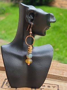 Amber Hoop earrings. Hammered copper earrings. Gemstone earrings. Boho copper earrings. Rustic earrings. Ethnic jewelry. The ear wires are handcrafted from pure copper wire. The copper component is annealed, hammered and polished with Renuesanse wax. ● Material - Copper, Natural stone ● Measures - Total length including the ear wires - about 2.5 inches Artisan Copper Wire Drop Earrings, Copper Wire Wrapped Round Hoop Earrings, Wire Wrapped Copper Hoop Earrings, Artisan Copper Dangle Hoop Earrings, Hand Forged Copper Dangle Hoop Earrings, Artisan Handmade Copper Wire Earrings, Hand Forged Copper Hoop Earrings With Dangle, Artisan Handmade Earrings With Copper Wire, Artisan Handmade Earrings In Copper Wire