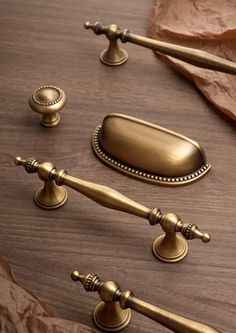 brass handles and knobs on a wooden table