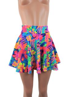 "Tahitian floral Neon print spandex skater skirt 15\" shown on mannequin.High waist skirt can be worn lower or higher most skirts allow you to place the waistline where it suits you on your particular body shape and personal desire! this fun flirty skirt is a full circle design and can be ordered in lengths of 10 inch, 12 inch, 15 inch and 19 inch- if you need a longer length contact me for a quote. Any of my items can be made in any spandex fabric, also any item can be matched if you like a ski Printed Fitted Skirt For Vacation, Fitted Printed Skirt For Vacation, Fitted Flared Mini Skirt For Beach, Fitted Floral Print Skirt For Vacation, Fitted Lined Mini Skirt For Beach Season, Beach Fitted Printed Skirt, Beach Floral Print Mini Skirt, Floral Print Skirted Skort For Vacation, Fitted Printed Beach Skirt