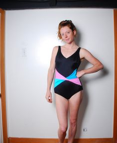 80s 90s black one piece swimsuit MATERIAL 85% Antron nylon 15% Lycra spandex MAKER: Slim Allure made in the USA CONDITION great vintage condition fully lined in front built in bra sanitary tape still attached SIZE womens 10 check measurements as vintage sizes are different from today double measurements for exact size stretch to the material pits 16 in. waist 12 in. hips 16 in. length from top of shoulder to crotch 27 in. thigh 9 in. model is 5'6'' bust 33in. waist 27in hips 35in. wears a dress Retro Color Block Swimwear, Retro Color Block Swimwear For Swimming, Retro Color Block Swimwear For Poolside, Retro Black Swimwear For Beach Season, Retro Black Stretch Swimwear, Retro Black Swimwear For Summer, Black Color Block Swimwear For Swimming, Retro Fitted Black Swimwear, Mod Party