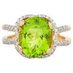 This collection features an array of pretty peridot rings! Accented with diamonds these rings are made in yellow gold and present a vibrant and fresh look. Classic peridot ring in 18K yellow gold with diamonds. Peridot: 4.5 carat oval shape. Diamonds: 0.519 carat, G colour, VS clarity. Gold: 5.44g, 18K yellow gold. Ring Size: US 6.75 - Size can be adjusted for free upon request - please reconfirm with your order. R540 Luxury Brilliant Cut Peridot Jewelry, Luxury Elegant Peridot Rings, Luxury Peridot Three Stone Rings, Luxury Peridot Gemstone Ring, Unique Luxury Peridot Rings, Peridot Rings, 5 Carat Ring, Dream Engagement, Dream Engagement Rings