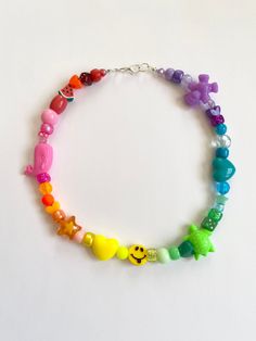 "🍧🌈Rainbow Sherbet Necklace🌈🍧 FREE SHIPPING You will receive one necklace like those similar to pictures. Bead pattern will be a rainbow of color. Made to order and beaded by me with luvvv <3 Strung on strong cord with a mixture of bright, random, and fun beads similar to picture. Lobster clasp closure. Each necklace is unique and no necklace looks exactly alike. NECKLACE LENGTH OPTIONS Option 1 💓 14\" Option 2 🌟 16\" Choose your desired length before purchase 🍧 (if no length is chosen Rainbow Letter Beads For Festival, Playful Rainbow Jewelry For Festivals, Trendy Rainbow Beaded Necklaces With Round Beads, Trendy Rainbow Beaded Necklaces, Trendy Rainbow Beaded Necklace With Round Beads, Playful Rainbow Beaded Necklaces, Playful Rainbow Necklaces With Round Beads, Playful Rainbow Round Bead Necklaces, Retro Beaded Necklaces For Festivals