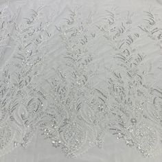 Introducing the exquisite collection of Beaded Lace Fabric Embroidered on 100% Polyester Net Mesh from Lace USA. This special collection is the perfect choice for a range of occasions, from bridal to quinceaneras, dance costumes and evening gowns. Our sheer lace couture is enhanced with intricate beading and embroidery, making it ideal for creating luxurious and elegant garments. Woven with lightweight polyester, the lace fabric is deceptively durable allowing it to be used for both decorative p Lace Couture, Quincenera Dresses, Dresses Dance, Intricate Beading, Beading Netting, Beaded Lace Fabric, Bridal Lace Fabric, Dresses Quinceanera, Fabric Beads