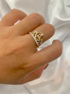 -14K Elephant Ring  -100% Gold  -Tricolored Gold  -Size 7  -Cubic zirconia  -Item sold by piece. Weight undetermined. Fine Jewelry Rings With Crown Design For Gift, Fine Jewelry Crown Design Rings As Gift, Fine Jewelry Crown Design Rings For Gift, Crown Shaped Fine Jewelry Rings For Gifts, Rose Gold Diamond Jewelry With Crown Design, Exquisite Rings With Diamond Accents And Cubic Zirconia, Fine Jewelry Crown Shaped Diamond Ring, Crown Shape Diamond Ring With Accents, Elegant Gold Diamond Ring With Crown Design