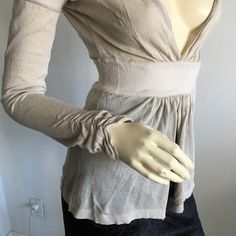 Nwt Vintage Gianfranco Ferre Long Sleeved Deep Plunged V-Neck Peplum Knit Top. Sleeves Have Ruching On Cuffs. Material Is Viscose And Nylon. Feels Like Linen Knit. Would Need To Wear A Bralette Or Camisole Underneath. Oatmeal Color. Size Small. Approx Measurements Laying Flat And Relaxed: Waist 23" (Stretches To About 28", Length From Shoulder 23". Made In Italy * Please Do Not Use My Photos Without Permission Mock Neck Blouse, Gianfranco Ferre, Short Sleeve Shirt Women, Deep Plunge, Silk Camisole, Oatmeal Color, Couture Tops, Knitted Tank Top, Blouse Vintage