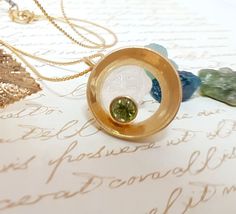 This listing is for my Minimalism designed,22K Gold Plated Necklace with inlaid green Swarovski crystal.This Necklace comes in a beautiful gift box. Each is made to order, so each one is a bit different. Circle diameter: 2.5 cm (0.98" )Necklace length - 46 CM (18")Please see more Gold Necklaceshttp://www.etsy.com/shop/gazellejewelry/search?search_query=gold+necklaceRound Pendanthttp://www.etsy.com/shop/gazellejewelry/search?search_query=round+pendant Matching Gold Ringhttp://www.etsy.com/shop/ga Unique Peridot Jewelry For May Birthstone, Gift Yellow Gold Peridot Gemstones, Green Citrine Jewelry For Gifts, Green Citrine Jewelry Gift, Oval Citrine Green Jewelry, Green Citrine Round Jewelry, Oval Green Citrine Jewelry, Green Round Citrine Jewelry, Fine Green Citrine Jewelry