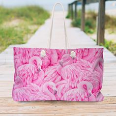 "Our oversized Weekender Pink Flamingo Tote is perfect for your weekend at the beach or in town. The wide-mouthed, durable bag holds a generous amount of personal items and is easily held by its thick rope handles. Stylish gift idea. .: 100% Spun Polyester .: T-bottom .: Cream sheeting interior lining .: One size: 24\" x13\" (60.9 cm x 33 cm) .: Handle height, in 11.42, cm 29.00 .: NB! Size tolerance 0.75\" (1.9 cm)) Care instructions: Before cleaning the bag, remove all the items from the bag. Holiday Tote Bag, Sac Week End, Thick Rope, Cat Top, Soft Bristle Brush, Rope Handles, Pink Flamingo, Stylish Gifts, Pink Flamingos