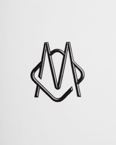 a black and white photo of the letter m on a white surface with lines in it