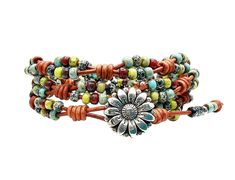 This handcrafted triple wrap bracelet showcases a combination of multicolor Picasso finished seed beads and premium rustic leather. Its design offers remarkable versatility, effortlessly complementing various casual outfits. The enduring appeal of boho jewelry is exemplified in this piece, as it remains a timeless fashion choice. The focal point of this knotted wrap bracelet is an intricately designed daisy nickel button closure. Whether worn individually or layered with other bracelets, this bohemian-inspired accessory adds a touch of charm to any ensemble. Please be aware that slight variations in color may occur due to lighting effects and disparities in computer displays. While we strive to provide accurate photographs, we cannot guarantee an exact match between the product and the ima Bohemian Bracelets For Spring, Bohemian Wrap Bracelet With Round Beads, Bohemian Spring Bracelet, Spring Bohemian Flower Bracelet, Bohemian Adjustable Bracelets For Spring, Spring Bohemian Adjustable Beaded Bracelets, Bohemian Brown Flower Jewelry, Adjustable Hippie Flower Jewelry, Adjustable Brown Jewelry For Spring