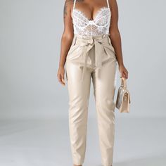 Details: Material: 55% Polyester, 45% Pu Fashion Element: Self Tie Waist Strap Closure: Front Clip On And A Zipper Closure Side Pockets Model Stats Height: 5.5" Bust:36" / Waist:28" / Hips:44" Model Is Wearing A Small Size Measurement (In) Size Waist Hips S 26-27 25-36 M 28-29 37-38 L 30-31 39-40 Beige High Waist Party Pants, Beige High Waist Pants For Party, Beige High-waist Pants For Party, Chic Beige Party Pants, Beige High Waist Party Bottoms, High Waist Beige Pants For Night Out, Elegant Paperbag Waist Bottoms, Chic Beige Pants For Night Out, Chic Paperbag Waist Pants For Night Out