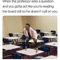 a man jumping in the air over desks with one leg on top of another