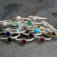 Create your own unique set of stacking rings. Select a stacking ring to represent your birthday or the birthdays of the ones you love. Or, create your own colorful set by mixing and matching your favorite colors and gemstones. The gems are 4mm. Set in solid sterling silver. Birthstone: January - Garnet February - Amethyst March - Aquamarine April - Clear Topaz May - Green Onyx June - Pearl July - Lab Ruby August - Peridot September - Lab Sapphire October - Lab Opal November - Citrine December - Stackable Rings With May Birthstone For Birthday, Gift Stackable Rings With Bezel Setting For May Birthstone, May Birthstone Stackable Rings For Gift, May Birthstone Stackable Rings With Bezel Setting, Stackable Bezel-set Rings For May Birthstone Gift, May Birthstone Stackable Round Rings, Stackable Round Birthstone Ring For Birthday, Adjustable Gemstone Stackable Rings, Dainty Gemstone Rings For Birthday