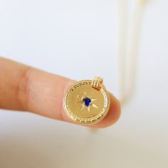 "Beautiful and lovely round medallion charm necklace. Made of navy blue CZ stone gold medallion charm with skinny chain. Simple and warm. Necklace will ship in a gift box. If you have any question, please feel free to contact me. Thanks :) ♥ Necklace length 15\"-20\" ♥ Pendant 3/4\" ♥ Gold plated over brass / Navy Blue Cubic Zirconia ♥ Delivery Time Fast shipping within 1 - 3 days ♥ See more Rudiana Accessories Rudiana.etsy.com" Blue Charm Necklace For Gift, Round Medallion Necklace With Charms For Gifts, Round Medallion Necklace With Charms As Gift, Blue Round Charm Necklace Gift, Blue Coin Pendant Jewelry As Gift, Medallion Pendant Necklace With Compass Design For Gift, Round Pendant Medallion Necklace With Compass Design For Gift, Medallion Necklace With Compass Design For Gift, Blue Coin Pendant Jewelry For Gifts