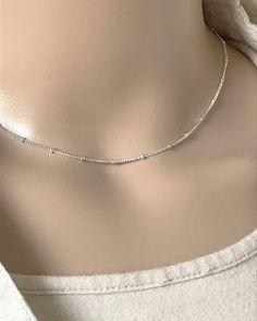 "Sterling Silver Satellite Chain Choker Necklace Beaded Minimalist and Dainty Necklace Simple, Everyday Necklace Metal: All components are made from Solid .925 Sterling Silver Necklace is adjustable **Choose Chain Length At Checkout** 14\"+2\"Ext 15\"+2\"Ext 16\"+2\"Ext Pictures Photographed at 15\" Please feel free to Convo me with any questions before purchasing. You can find other Dainty Minimalist Jewelry in my Shop here https://www.etsy.com/shop/LinksAndStones?ref=seller-platform-mcnav& Daily Wear Silver Chains For Women, Sterling Silver Beaded Necklace For Everyday, Minimalist Beaded Clavicle Chain Necklace For Everyday, Silver Minimalist Beaded Necklace With Delicate Chain, Everyday Silver Beaded Necklace With Delicate Chain, Everyday Sterling Silver Beaded Necklace, Sterling Silver Beaded Chain Necklace For Everyday, Minimalist Silver Necklace With Beaded Chain, Everyday Sterling Silver Beaded Necklaces